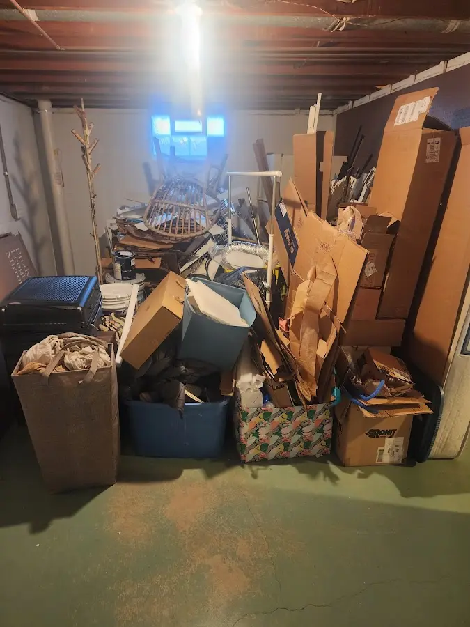 Roll-off dumpster container at job site for 2 Yard Dumpster Rental in Lillington